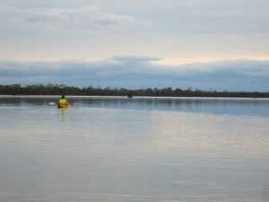 Kayaking across the still lagoon
